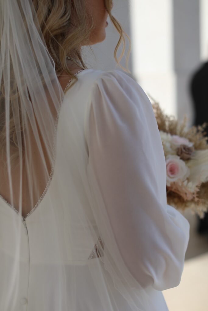 Open back wedding dress with veil