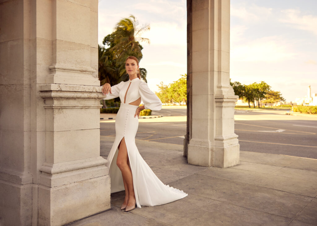 Satin wedding dress with long sleeves and cutouts